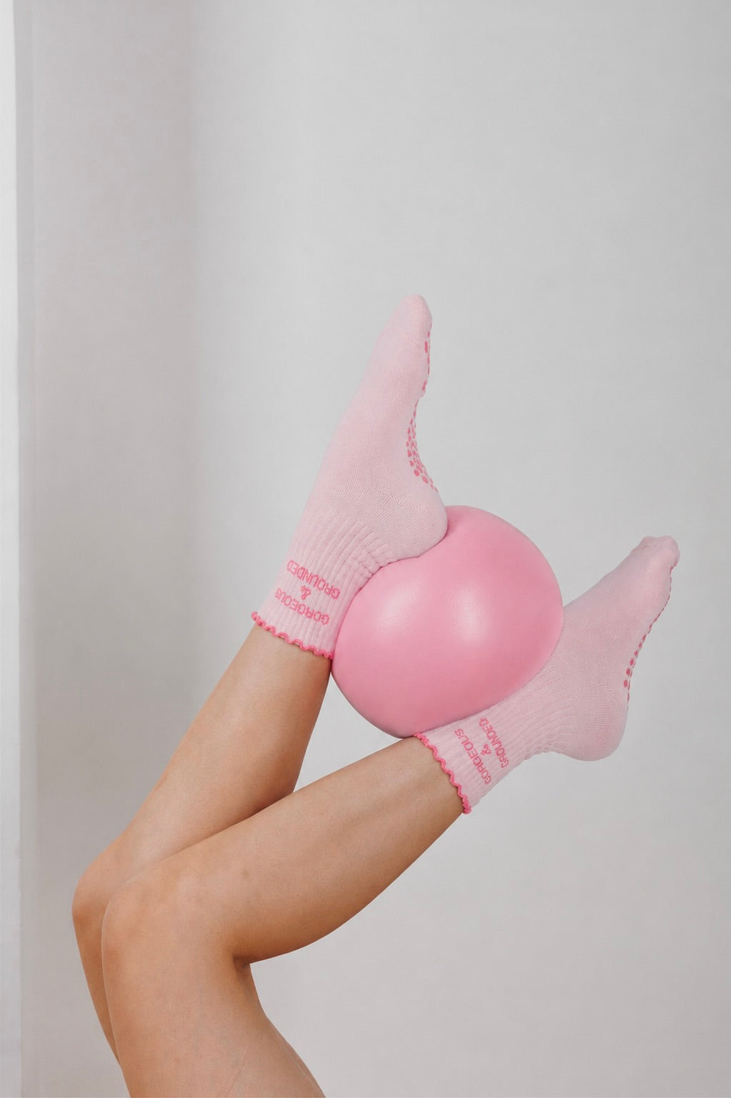 Pinke Pilates Socken mit Ball